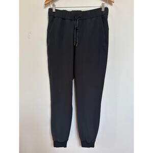 LULULEMON ON THE FLY JOGGER Womens Sz 6 Black Drawstring Stretch Pocket Pants